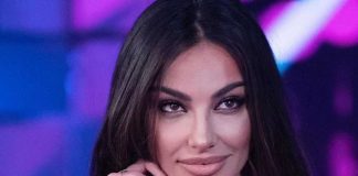 Madalina Ghenea minigonna gambe accavallate